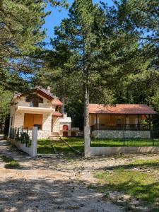 a house with a fence in front of it at Vikendica Ubla in Trebinje