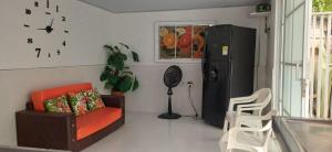 a living room with a couch and a refrigerator at Casa SAYBER DON DIEGO in Don Diego +1 photo
