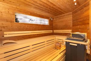 a wooden cabin with a sauna at Pension Seighof - Geschichte zum Anfassen seit 1366 - inkl Bergbahnen im Sommer - regionales Frühstück - Bergpanorama - Joker Card in Saalbach-Hinterglemm