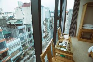 a room with a window with a view of a city at Tân Trang in Ha Long