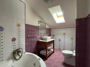 a bathroom with a sink and a toilet at Posadaochohermanas in Las Fraguas +21 photos