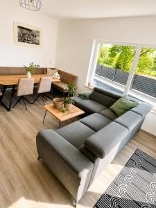 a living room with a couch and a table at Villa Tadini JOY in Babići +62 photos