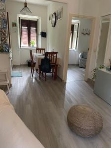 a living room with a table and a dining room at Appartamento La Fontina in Marciana Marina