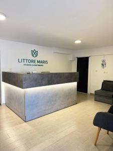a lobby of a store with a reception desk at Littore Maris in Nea Vrasna
