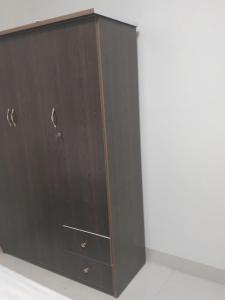 a brown cabinet with two drawers on a wall at PHƯƠNG LƯU Hotel in Văn Lâm