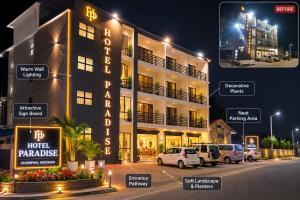 a hotel building with cars parked in front of it at Hotel Paradise in Neihdawn
