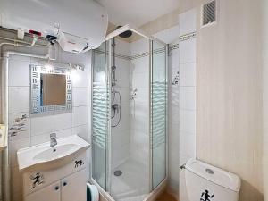 a bathroom with a shower and a sink at Charmant Studio Cabine 4 Pers, Balcons, Parking Privé, à 300m de la Plage de Merville-Franceville - FR-1-465-37 in Merville-Franceville-Plage