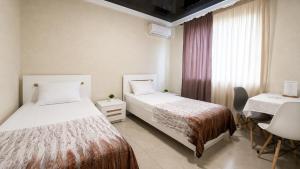 Ліжко або ліжка в номері Bloom Hotel +61 фото