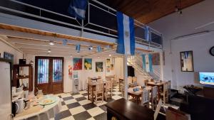 a room with tables and chairs and a staircase at HOTEL COSTANERA - Mejor Ubicacion en FORMOSA in Formosa