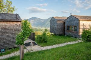 a house with a playground in the middle of a yard at Rosenholz Ferienhäuser in Köttmannsdorf +62 photos