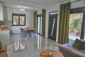 a living room with a table and a couch at Vikanto Stay in Ulcinj