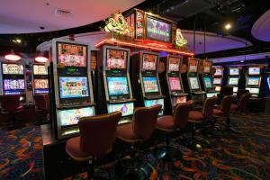 a bunch of slot machines in a casino at Paseo Premiere Hotel in Santa Rosa