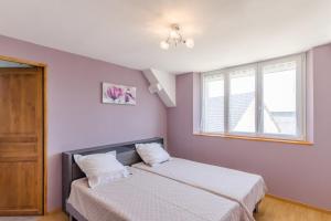 a bedroom with a bed and a window at Le saint remeau in Le Jard +7 photos