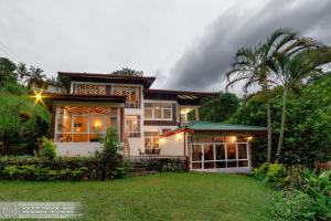 a house with a lawn in front of it at The Montfort - Kandy in Kandy