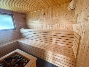 a wooden sauna with a bench in it at Pension Höchemer in Bad Bocklet
