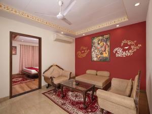 a living room with a couch and a table at Radhey Ki Haveli in Khātu +34 photos