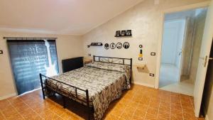 a bedroom with a bed in a room at BB Diesis in Ferrazzano