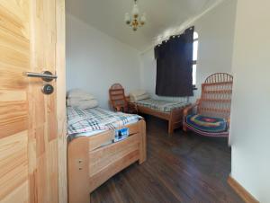 a small room with two beds and a window at Hostel MIF in Ivano-Frankivsʼk