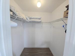 a room with a closet with shelves at Downsview Park Retreat 1 - Rogers Stadium Getaway in Toronto