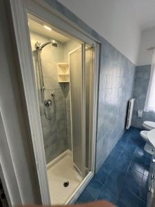 a shower with a glass door in a bathroom at Vista mare in San Vincenzo