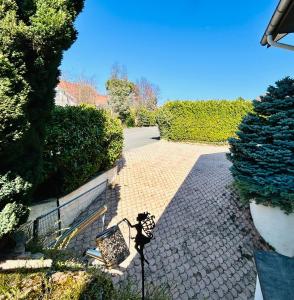 a stone path with a bench and a fence at Beausoleil SPA Villa L-Geneva, Lake, Mountains-Full Love Stay-SPA optional extra fee in Chens-sur-Léman