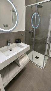 a bathroom with a sink and a shower at Moon Apartments A in Soverato Marina
