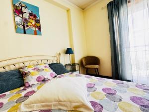 a bedroom with a bed and a window at Cavado Pool Apartment in Fão