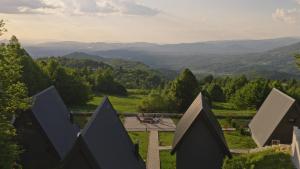 a view of the mountains from the top of a house at Klek 77 Luxury Chalets near Jahorina in Paočići