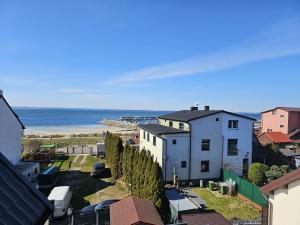 a view of a house and the ocean from a building at Mewa House in Jastarnia
