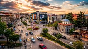 a city with cars on a busy city street at Downtown Bayrak Residences Trabzon in Trabzon