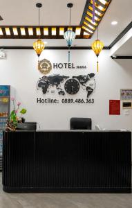 a hotel lobby with a sign on the wall at Khách Sạn Phố Cổ Ninh Bình NANA HOTEL in Kỳ Vĩ +36 photos