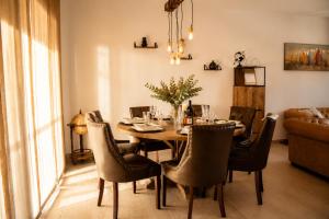 a dining room with a table and chairs at Casa ZOMABRIA in Poreč