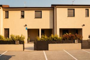 a building with a parking lot in front of it at Casa ZOMABRIA in Poreč