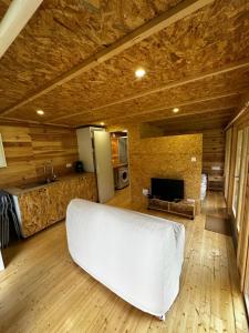 a bedroom with a white bed in a room at L'Écrin du Neudorf in Strasbourg