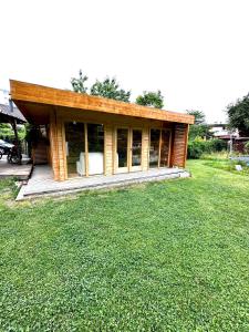 a small house with a lawn in front of it at L'Écrin du Neudorf in Strasbourg