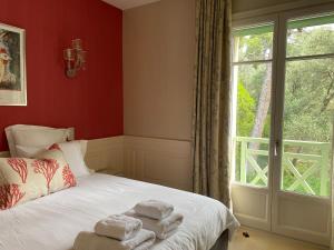 a bedroom with a bed with towels on it at Villa Cœur de Mer in Nice +66 photos