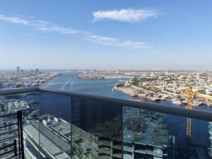a view of a river from the top of a building at Sea View Apartment with Balcony in Ajman  +4 photos