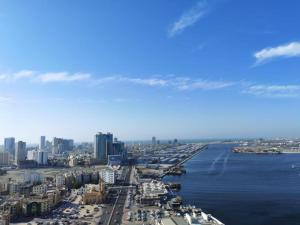 an aerial view of a city and the water at Sea View Apartment with Balcony in Ajman 