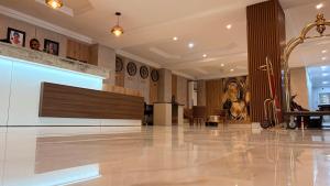 a lobby with a large screen in a building at Visa Karena Hotels in Port Harcourt +105 photos