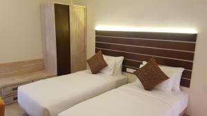 Tempat tidur dalam kamar di Hotel Cloud 9 Negombo