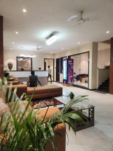 a lobby with couches and tables in a building at Hotel Manchester Royals LLP in Boria Kalān
