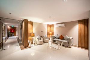 a living room with couches and tables in a room at Nawara Dala - Economic in Riyadh +99 photos