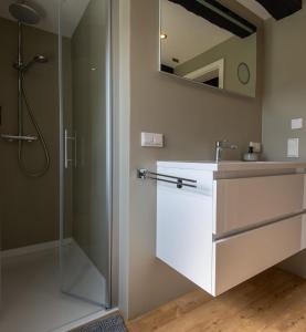 a bathroom with a shower and a sink and a mirror at Haus zur Mühle in Winterberg +77 photos
