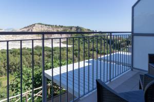 a balcony with a view of the ocean at Vulcanica By Dimorra in Pozzuoli