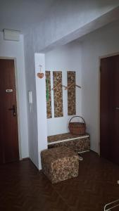 a room with a couch and a chair and a door at U babiny in Martinske Hole