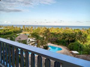 a view of the ocean from the balcony of a resort at Heaven place -1 bedroom beachfront unit in Ukunda