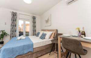 a bedroom with a bed and a table and a desk at Olive Dreams in Biograd na Moru +70 photos