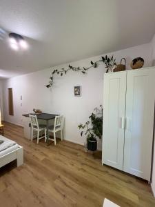 a living room with a table and a table at Gemütliche Wohnung in Passau in Passau