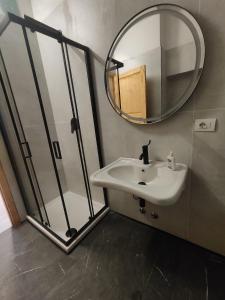 a bathroom with a sink and a mirror at Zippy Hostel in Milan