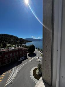 a view from a window of a street and the ocean at Sunset Suite in Laveno-Mombello +2 photos